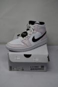 A pair of as new Nike Air Jordan 1 mid (UK 5.5).