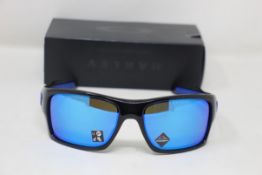A boxed as new pair of Oakley Turbine Sunglasses in Black Ink with Prizm Sapphire Lens (REF: OO9263,