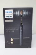 A boxed as new Phillips Sonicare 9900 power toothbrush with sense IQ.
