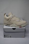 A pair of women's boxed as new Air Jordan 4 Retro 'Canvas Sail' Sneakers (UK 7.5).