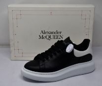 A pair of Alexander McQueen oversized sneakers with authenticity tag (Size 42).