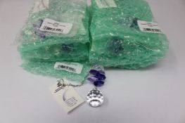 Twelve as new Woodstock Chimes Crystal Sunrise Cascade Sun-Catchers in Purple (EAN: 028375270118).