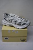 A pair of as new Axel Arigato Marathon R-Trail Trainers in White (Size UK 6).