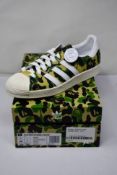 A pair of as new Adidas x BAPE Superstar 80s (Size UK 7).
