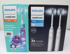 A Philips Sonicare 3100 Electric Toothbrush HX3675 (2 pack) and a Philips Sonicare For Kids HX6322/
