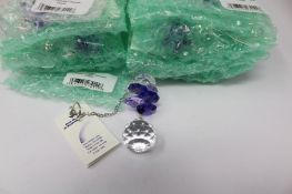 Twelve as new Woodstock Chimes Crystal Sunrise Cascade Sun-Catchers in Purple (EAN: 028375270118).