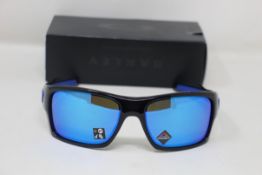 A boxed as new pair of Oakley Turbine Sunglasses in Black Ink with Prizm Sapphire Lens (REF: OO9263,