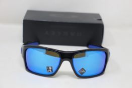 A boxed as new pair of Oakley Turbine Sunglasses in Black Ink with Prizm Sapphire Lens (REF: OO9263,