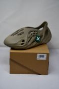 A pair of boxed as new Adidas Yeezy Foam Runner Stone Sage Yeezy , beige (UK 12).