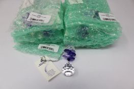 Twelve as new Woodstock Chimes Crystal Sunrise Cascade Sun-Catchers in Purple (EAN: 028375270118).