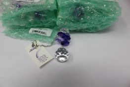 Twelve as new Woodstock Chimes Crystal Sunrise Cascade Sun-Catchers in Purple (EAN: 028375270118).