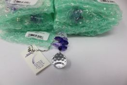 Twelve as new Woodstock Chimes Crystal Sunrise Cascade Sun-Catchers in Purple (EAN: 028375270118).