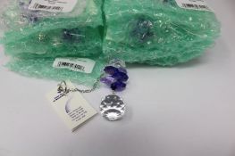 Twelve as new Woodstock Chimes Crystal Sunrise Cascade Sun-Catchers in Purple (EAN: 028375270118).