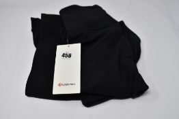 Two pairs of black LuLuLemon Groove Pant SHR flares (Size 8) (Security tags attached).