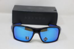 A boxed as new pair of Oakley Turbine Sunglasses in Black Ink with Prizm Sapphire Lens (REF: OO9263,