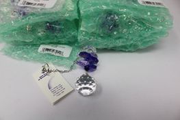 Twelve as new Woodstock Chimes Crystal Sunrise Cascade Sun-Catchers in Purple (EAN: 028375270118).