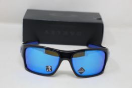 A boxed as new pair of Oakley Turbine Sunglasses in Black Ink with Prizm Sapphire Lens (REF: OO9263,