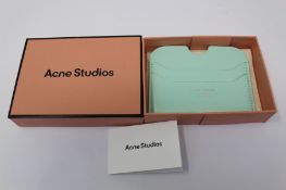 A boxed as new Acne Studios Leather Card Holder in Pastel Green.