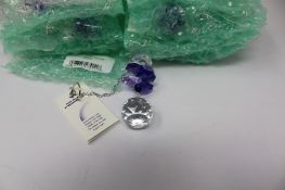 Twelve as new Woodstock Chimes Crystal Sunrise Cascade Sun-Catchers in Purple (EAN: 028375270118).