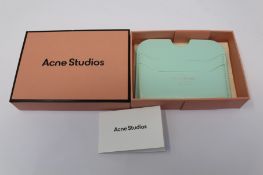 A boxed as new Acne Studios Leather Card Holder in Pastel Green.
