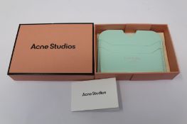 A boxed as new Acne Studios Leather Card Holder in Pastel Green.