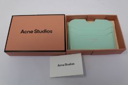A boxed as new Acne Studios Leather Card Holder in Pastel Green.