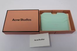 A boxed as new Acne Studios Leather Card Holder in Pastel Green.