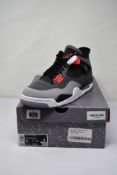 A pair of as new Nike Air Jordan 4 Retro in Dark Grey/Infrared 23-Black (Size UK 10).