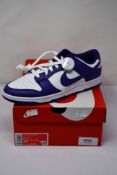 A pair of as new Nike Dunk Low Retro with authenticity tag (UK 9).