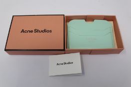 A boxed as new Acne Studios Leather Card Holder in Pastel Green.
