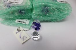 Twelve as new Woodstock Chimes Crystal Sunrise Cascade Sun-Catchers in Purple (EAN: 028375270118).
