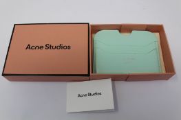 A boxed as new Acne Studios Leather Card Holder in Pastel Green.