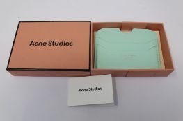 A boxed as new Acne Studios Leather Card Holder in Pastel Green.