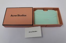A boxed as new Acne Studios Leather Card Holder in Pastel Green.