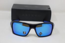 A boxed as new pair of Oakley Turbine Sunglasses in Black Ink with Prizm Sapphire Lens (REF: OO9263,