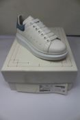 A pair of Alexander McQueen white and dream blue classic sneakers (Size 35).