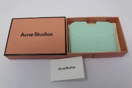 A boxed as new Acne Studios Leather Card Holder in Pastel Green.