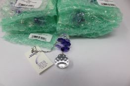 Twelve as new Woodstock Chimes Crystal Sunrise Cascade Sun-Catchers in Purple (EAN: 028375270118).