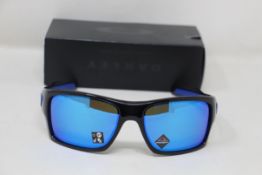 A boxed as new pair of Oakley Turbine Sunglasses in Black Ink with Prizm Sapphire Lens (REF: OO9263,
