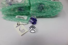 Twelve as new Woodstock Chimes Crystal Sunrise Cascade Sun-Catchers in Purple (EAN: 028375270118).