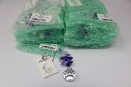 Twelve as new Woodstock Chimes Crystal Sunrise Cascade Sun-Catchers in Purple (EAN: 028375270118).