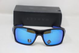 A boxed as new pair of Oakley Turbine Sunglasses in Black Ink with Prizm Sapphire Lens (REF: OO9263,