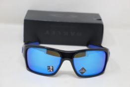 A boxed as new pair of Oakley Turbine Sunglasses in Black Ink with Prizm Sapphire Lens (REF: OO9263,