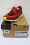 A pair of men's boxed as new Salomon Ultra Glide Trail Running Shoes in Biking Red/Lunar Rock/