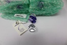 Twelve as new Woodstock Chimes Crystal Sunrise Cascade Sun-Catchers in Purple (EAN: 028375270118).