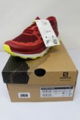 A pair of men's boxed as new Salomon Ultra Glide Trail Running Shoes in Biking Red/Lunar Rock/