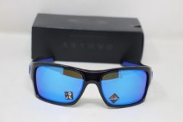 A boxed as new pair of Oakley Turbine Sunglasses in Black Ink with Prizm Sapphire Lens (REF: OO9263,