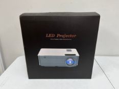 A boxed as new unbranded LED Projector (M/N: M5SW) (EU plug power cable, AV cable, 100