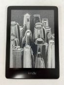 A pre-owned Amazon Kindle Paperwhite 11th Gen E-Reader (M/N: M2L3EK) (Grade B).