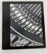 A pre-owned Amazon Kindle Oasis 10th Gen E-Reader (M/N: S8IN4O) (Grade B).
